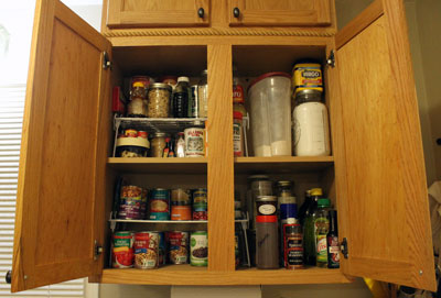 After. I merged a bunch of duplicate containers, took all the stuff that was stored in bags and put it in jars, and moved a bunch of spices to that new shelf I built yesterday, as the configuration of the cabinet was better for storing cans.